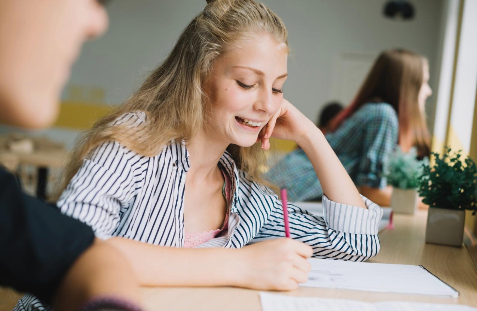 Student reviewing financial documents in organized workspace